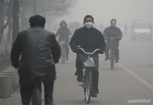 A man wears a mask as he rides a bike to work in the polluted town of Linfen. Linfen, a city of about 4.3 million, is one of the most polluted cities in the world. China's increasingly polluted environment is largely a result of the country's rapid development and consequently a large increase in primary energy consumption, which is almost entirely produced by burning coal.